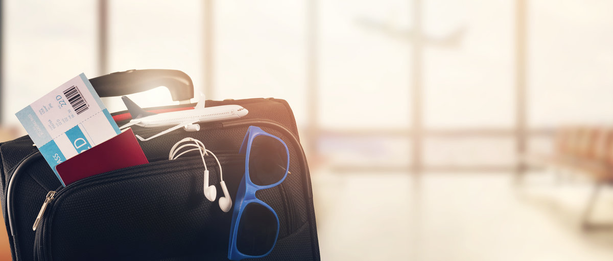 traveling luggage on airport terminal background with copy space