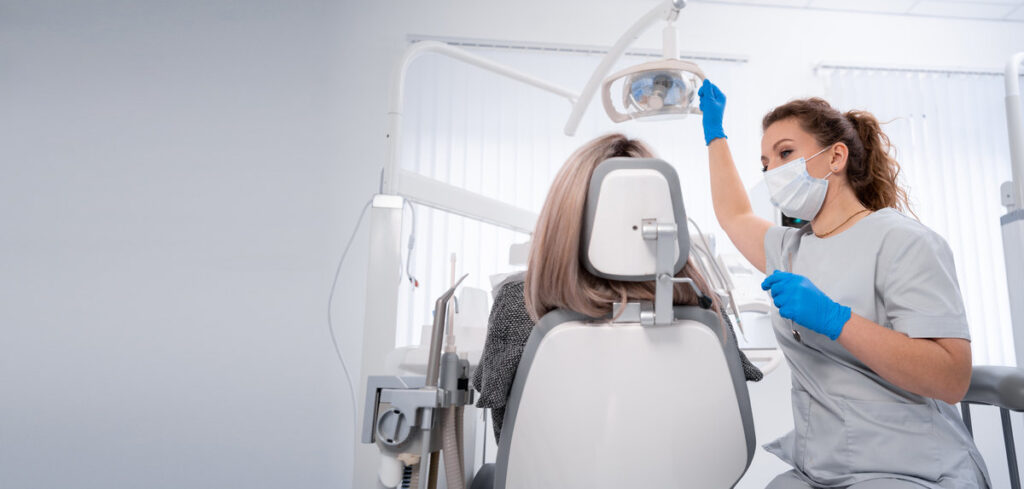 young caucasian woman dentist and patient. Dentist lifestyle scene. Doctoral practice. Patient healthcare. Banner. copy space.